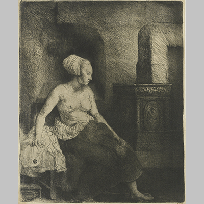 Rembrandt Woman sitting half dressed beside a stove 1658